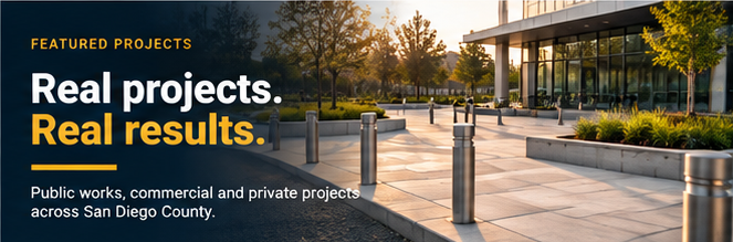 New concrete plaza with bollards and planters outside a civic building in San Diego County